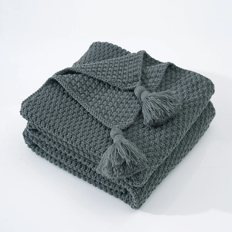 Strukturierte Strickwurfdecke