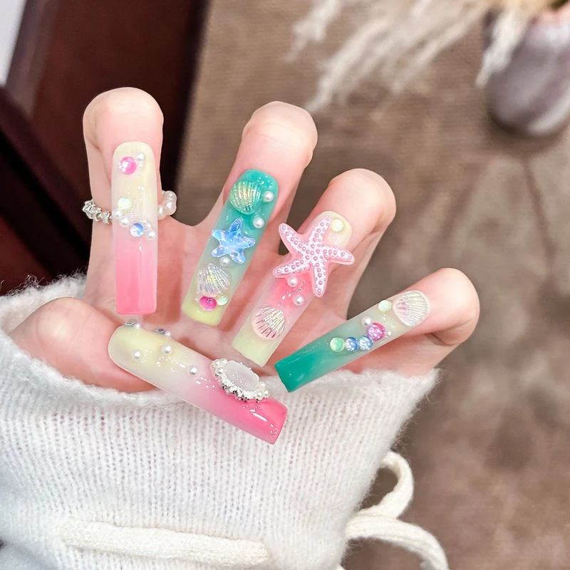 Künstlerisches Langes Press-On Nagelset mit ozeanischem Design