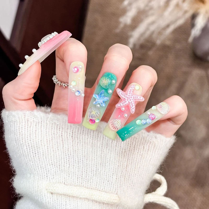Künstlerisches Langes Press-On Nagelset mit ozeanischem Design