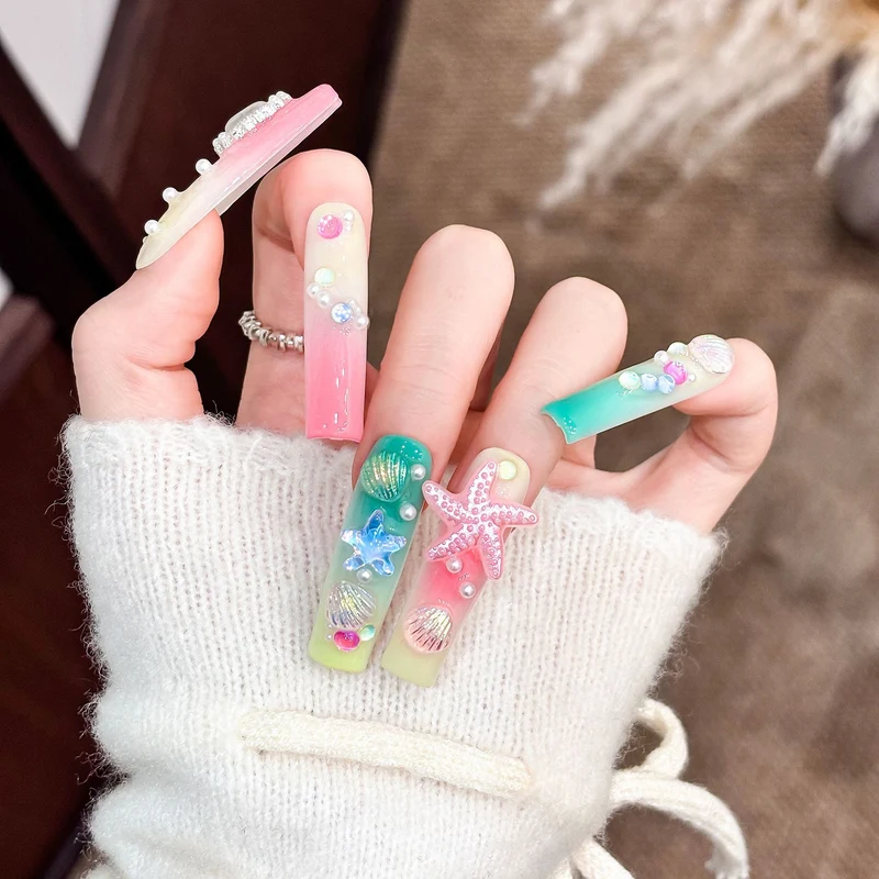 Künstlerisches Langes Press-On Nagelset mit ozeanischem Design