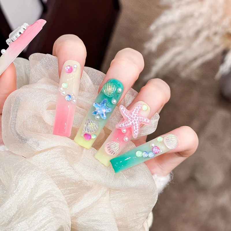 Künstlerisches Langes Press-On Nagelset mit ozeanischem Design