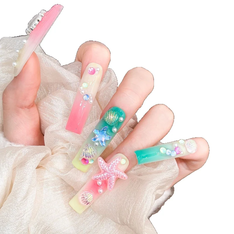 Künstlerisches Langes Press-On Nagelset mit ozeanischem Design