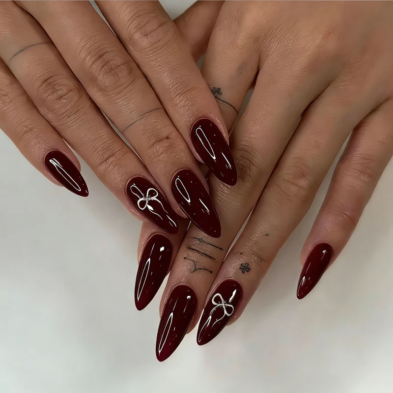 Elegante Stiletto Press-On Nägel mit Schleifen-Design