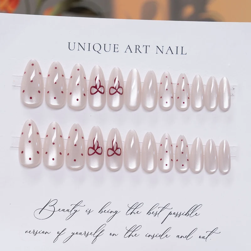 Elegante Stiletto Press-On-Nail-Art mit minimalistischen Schleifen-Design