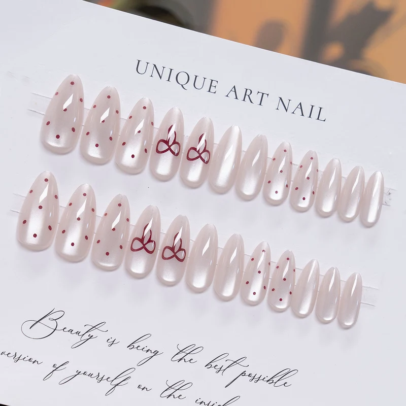 Elegante Stiletto Press-On-Nail-Art mit minimalistischen Schleifen-Design