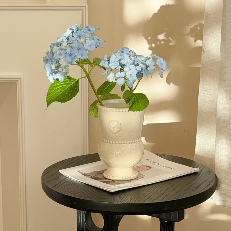 Ornamental Ceramic Double-Bulb Pedestal Vase with Beaded Rim and Cherub Relief