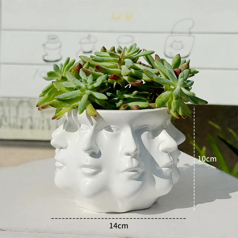Moderner Blumentopf mit geometrischem Gesichtsmuster
