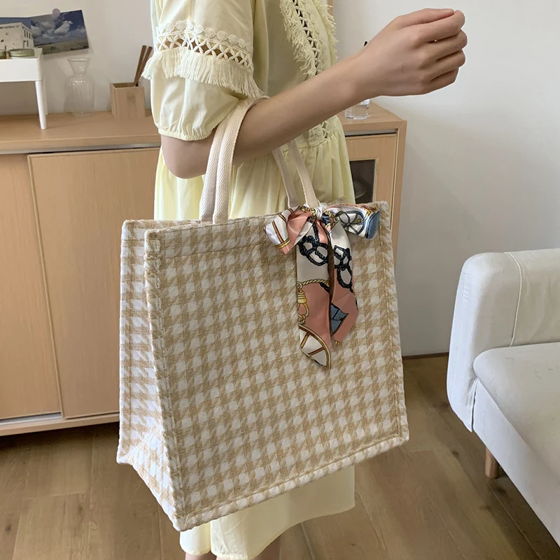 Elegante Houndstooth-Handtasche mit dekorativem Schleife