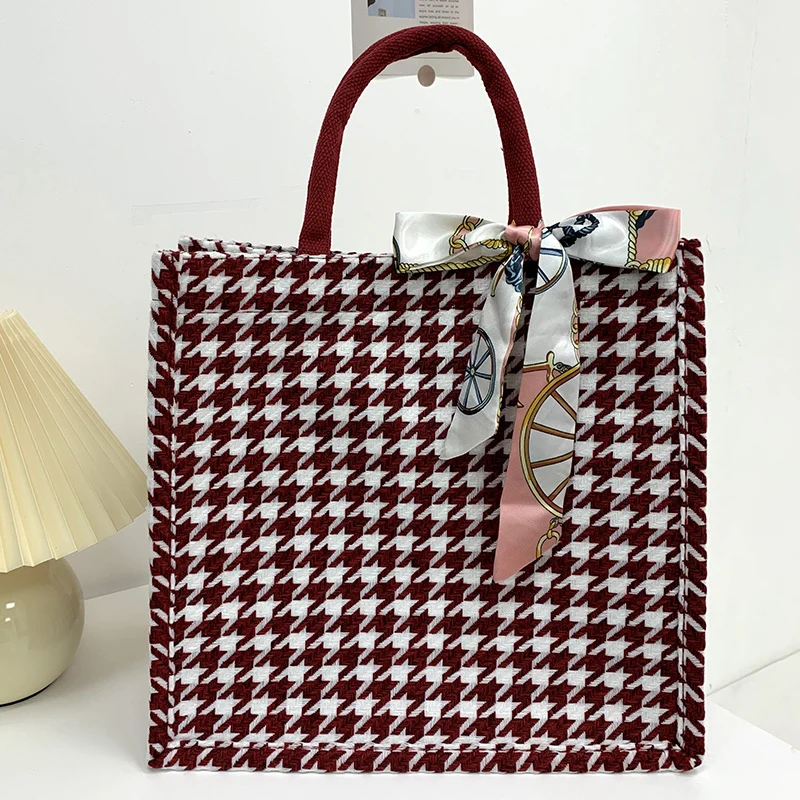 Elegante Houndstooth-Handtasche mit dekorativem Schleife