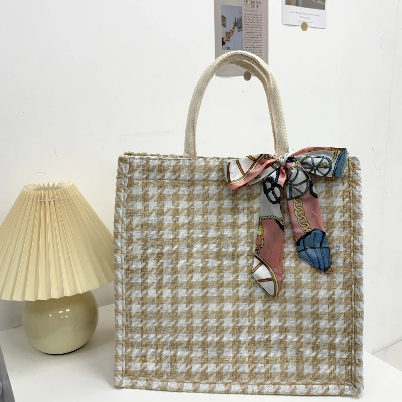 Elegante Houndstooth-Handtasche mit dekorativem Schleife