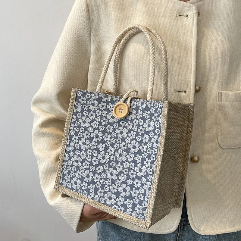 Elegante floral gemusterte Handtasche