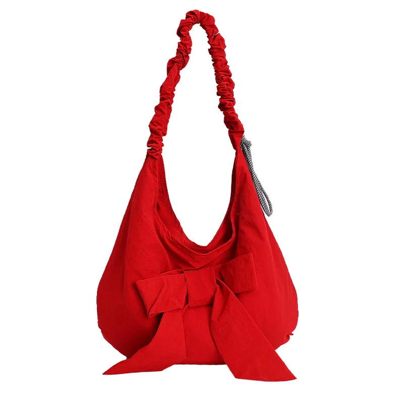 Schultertasche mit Schleifenverzierung