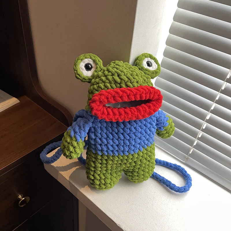Süßer froschförmiger gehäkelter Mini-Rucksack