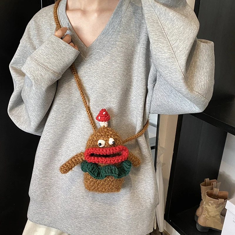 Niedliche gehäkelte Charakter-Handtasche