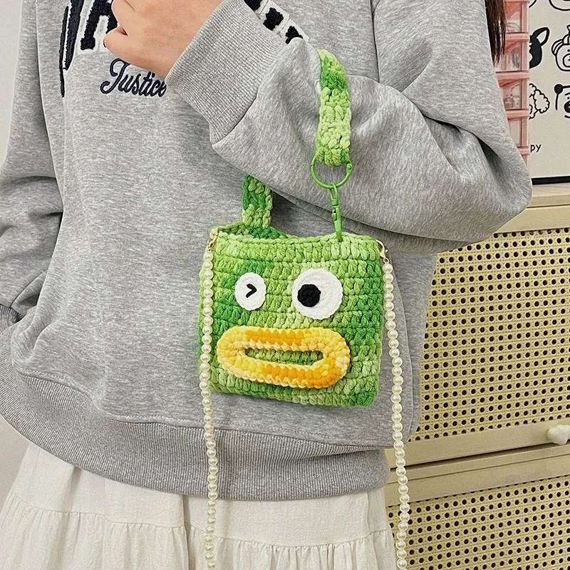 Niedliche gehäkelte Handtasche im Tierdesign