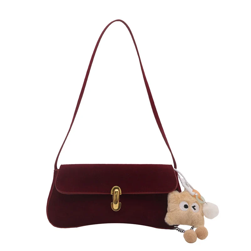 Elegante Wildleder-Handtasche mit verspieltem Schlüsselanhänger