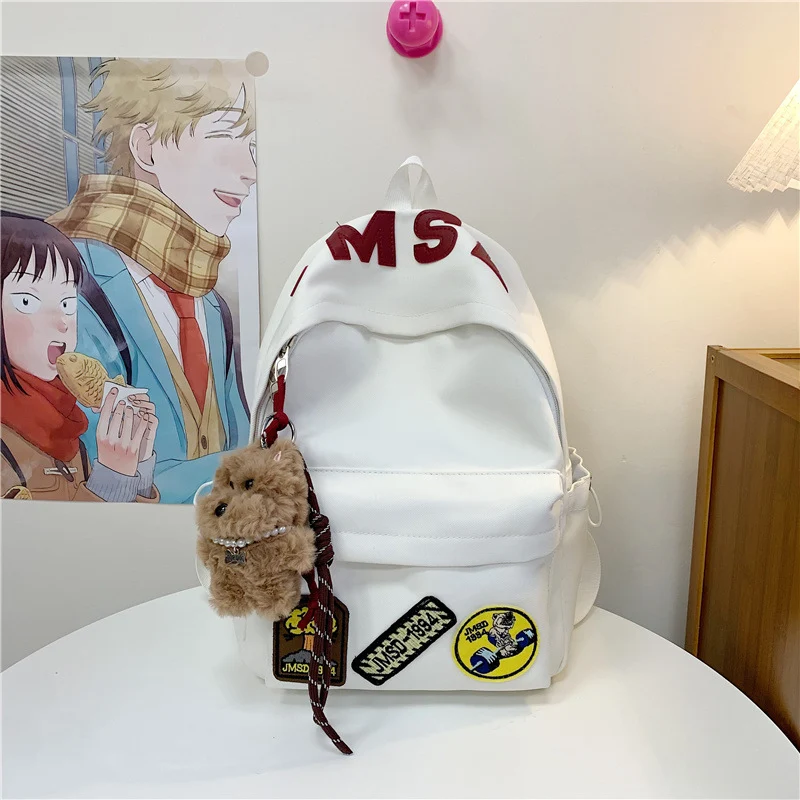 Lustiger Schulrucksack im Themen-Patchwork-Design