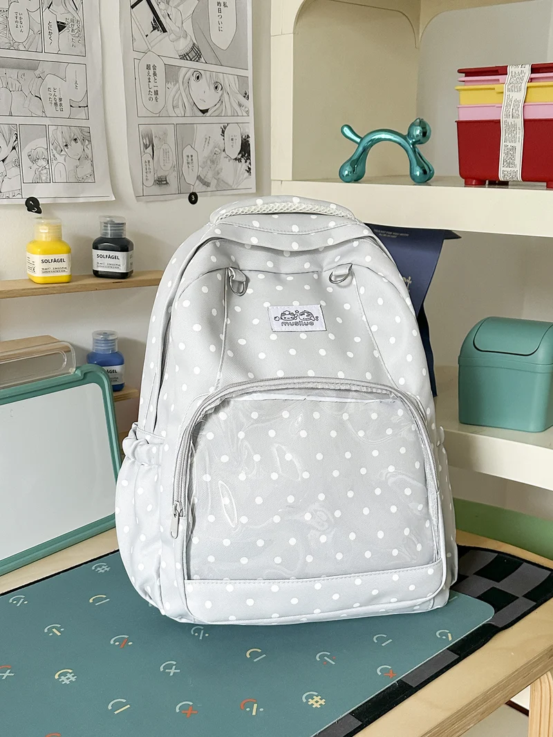 Lustiger gepunkteter Schulrucksack