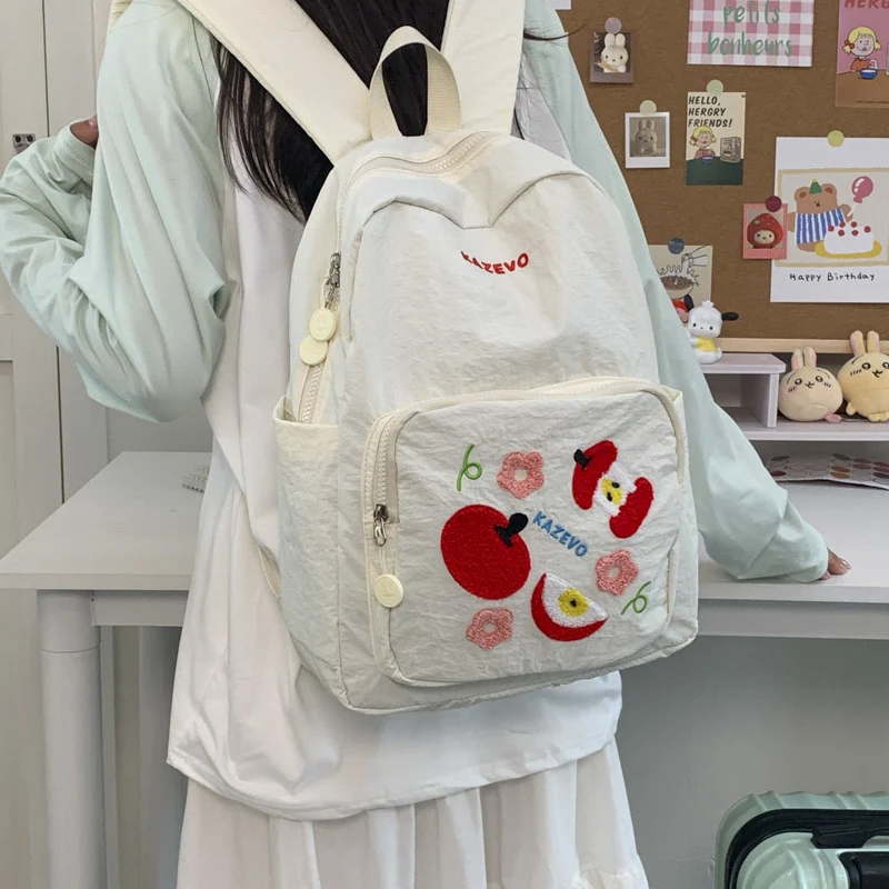 Bestickter Schulrucksack mit Fruchtmotiv