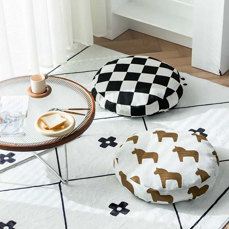 Rundes dekoratives Sitzkissen mit floraler Jacquard‑Struktur