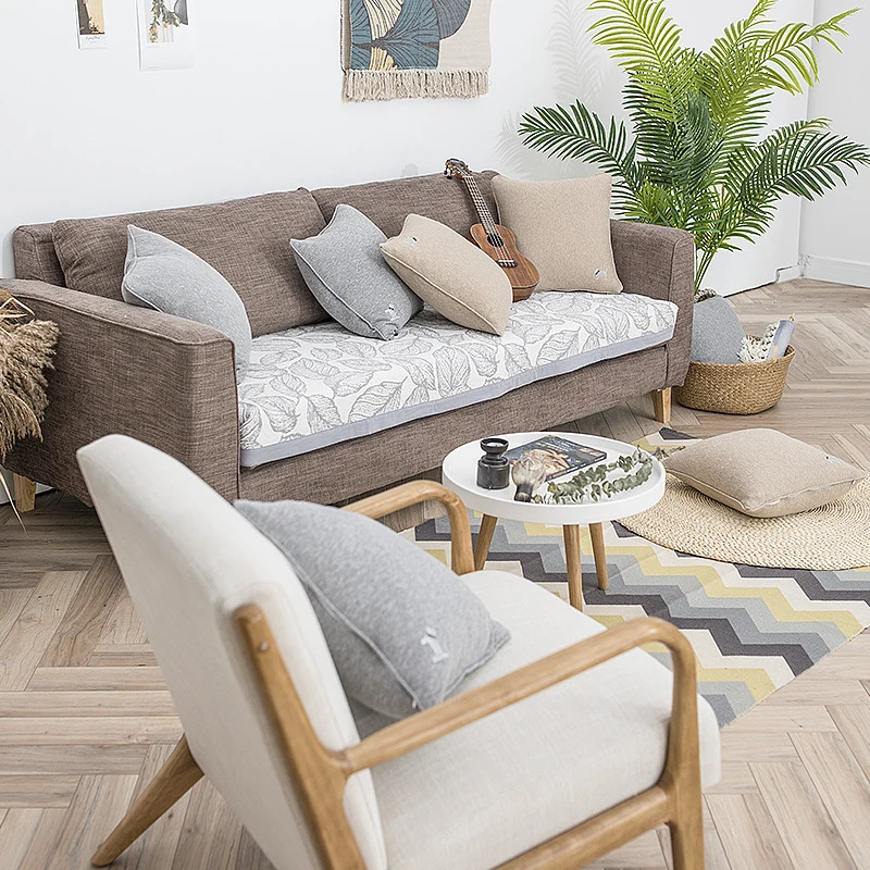 Quadratisches Kissenhüllen-Set mit natürlicher Leinenstruktur und feinem Stickmotiv
