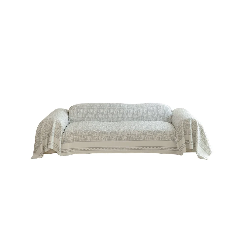 Geometrischer Sofaüberwurf aus Baumwollmischgewebe mit dekorativer Fransenkante