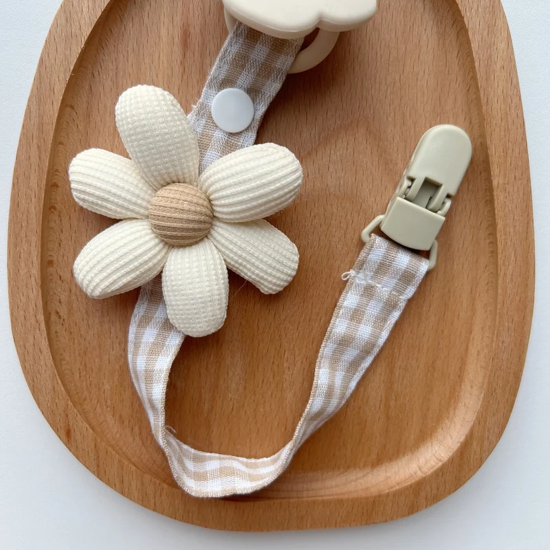 Blumenkleidungs-Schnullerclip mit Gingham-Baumwollgurt