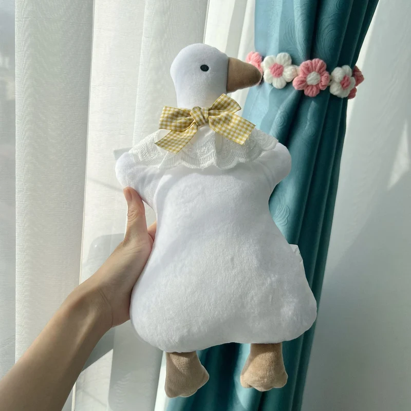 Plüsch-Ente Komfortkissen mit Gingham Schleife