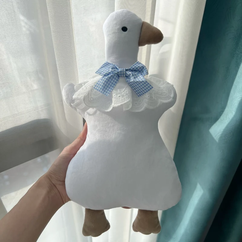 Plüsch-Ente Komfortkissen mit Gingham Schleife
