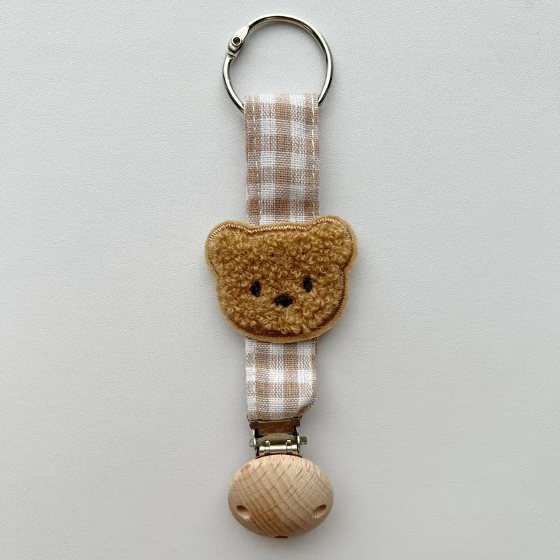 Handgefertigter Holz-Clip Schnullerhalter mit Gingham-Gurt und gepolstertem Blumenbeißring