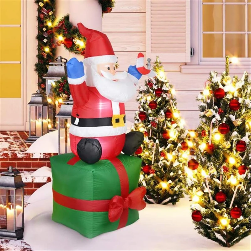 Aufblasbare Weihnachtsmann-Dekorationsfigur auf Geschenkpaket