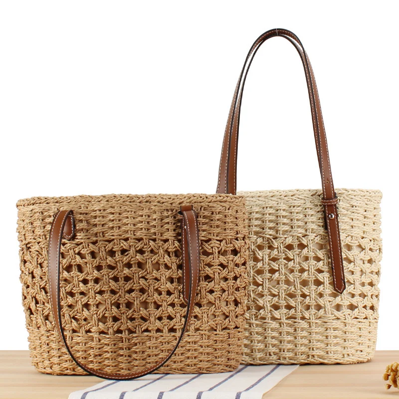 Handtasche aus handgewebtem Stroh mit eleganten Kunstledergriffen Skanto