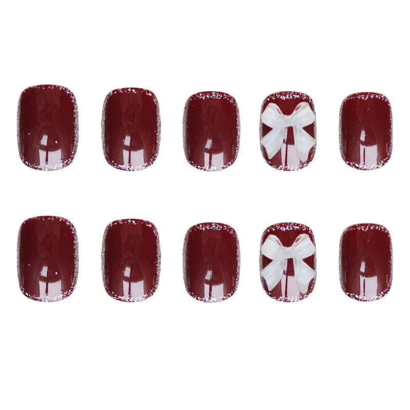 Künstlerisches Press-on-Nagelset mit Schleifen-Design