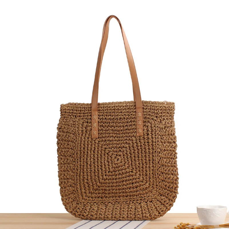 Tasche aus geflochtenem Naturmaterial mit weichen Ledergriffen Skanto