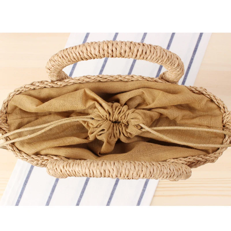Handtasche aus geflochtenem Naturmaterial mit rundem Griff Skanto