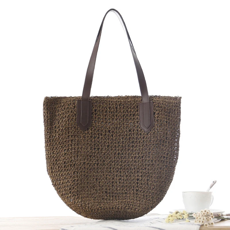 Handtasche aus geflochtenem Naturmaterial mit robusten Ledergriffen Skanto