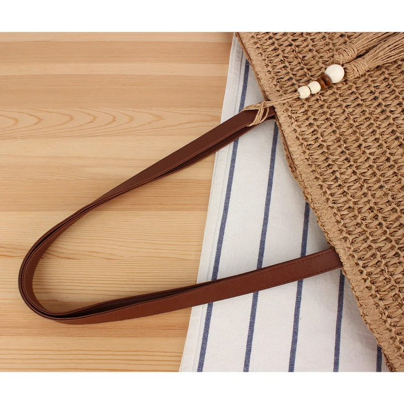 Handtasche aus geflochtenem Naturmaterial mit Quasten-Dekoration Skanto
