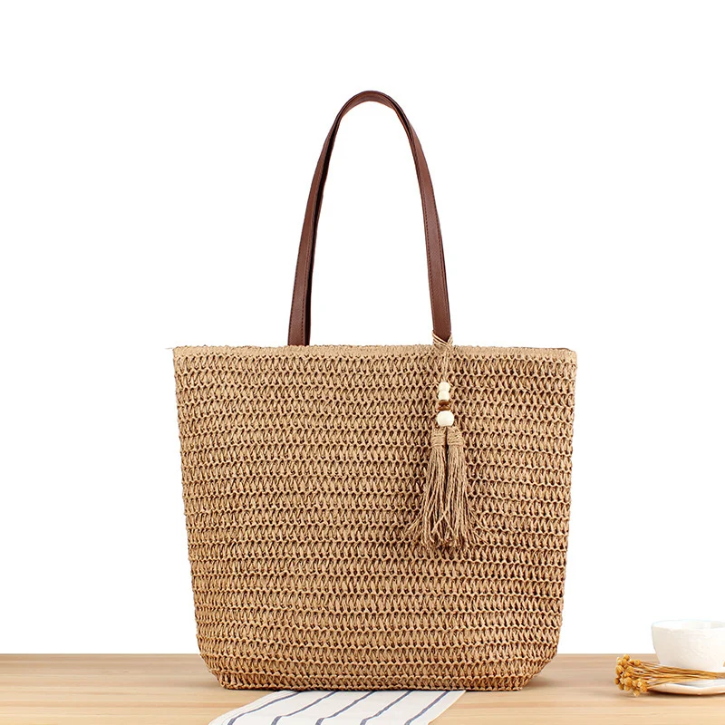 Handtasche aus geflochtenem Naturmaterial mit Quasten-Dekoration Skanto