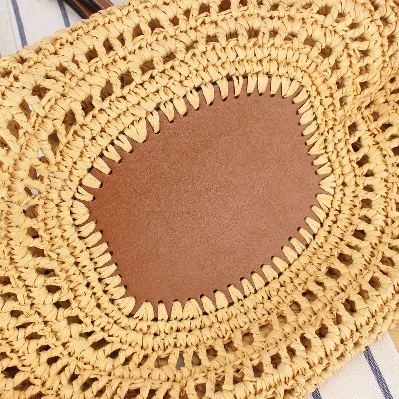Handtasche aus geflochtenem Naturmaterial mit hochwertigem Lederdetail Skanto