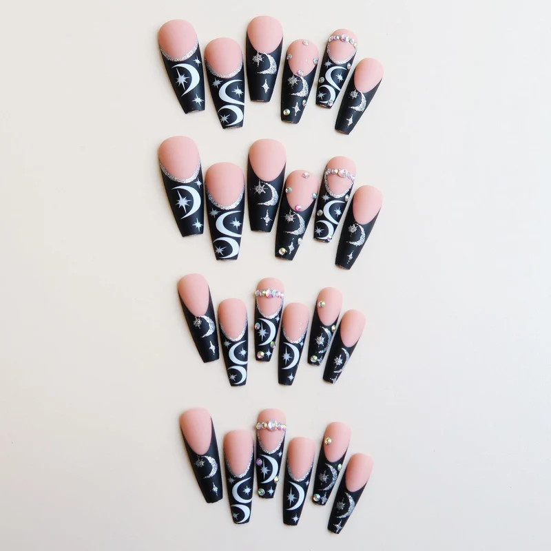 Künstlerisches langes Stiletto Press-On Nagelset mit Mond- und Sternmustern