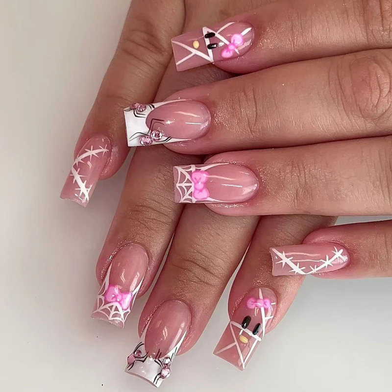 Dekoratives Nagelkunst-Set mit Schleife und Spinnennetzdesign