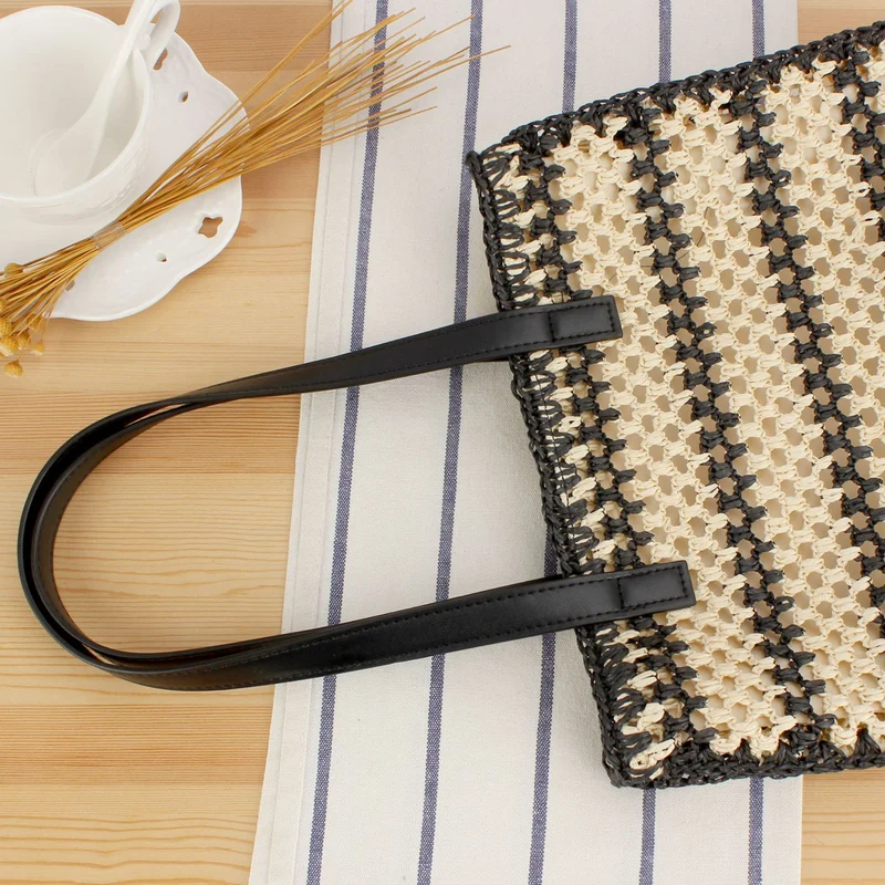 Handtasche mit robustem Flechtdesign und eleganten Ledergriffen Skanto