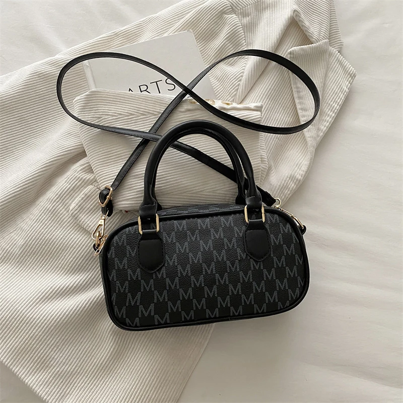 Stylische Monogram-Handtasche
