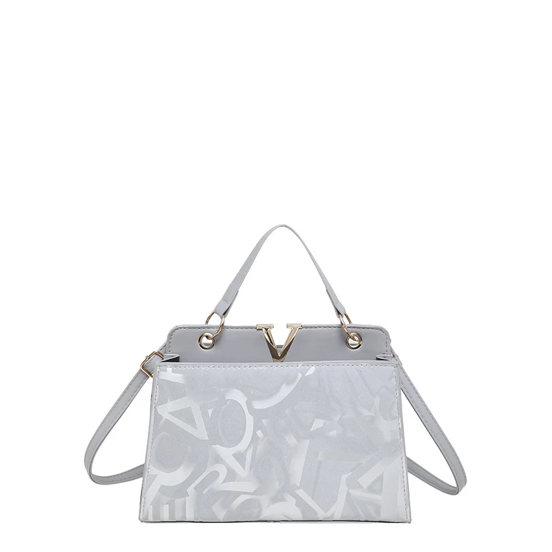 Glänzende strukturierte Handtasche