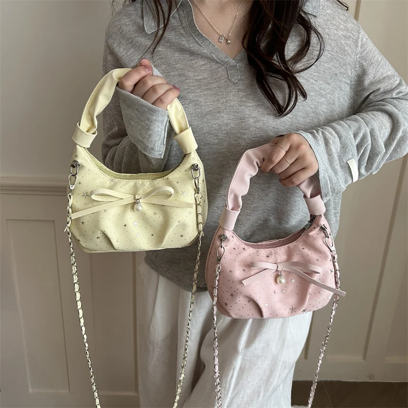 Elegante Handtasche mit Schleifendetail und Sternenprint