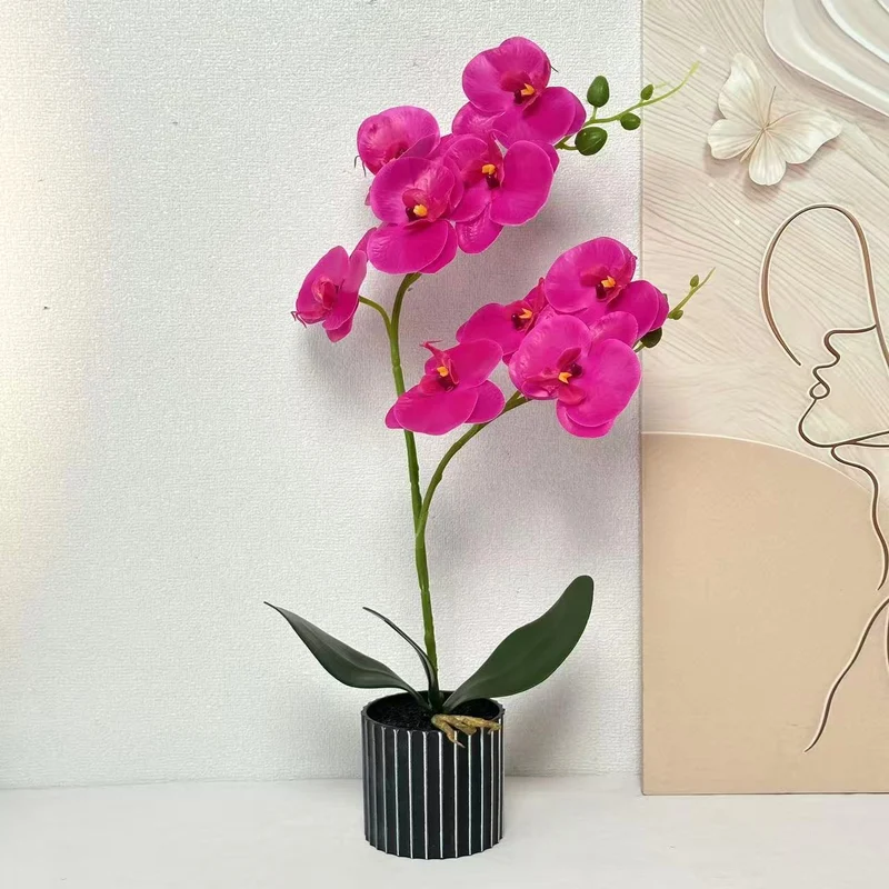 Künstliche Orchideenarrangement für die Innendekoration Zuhause