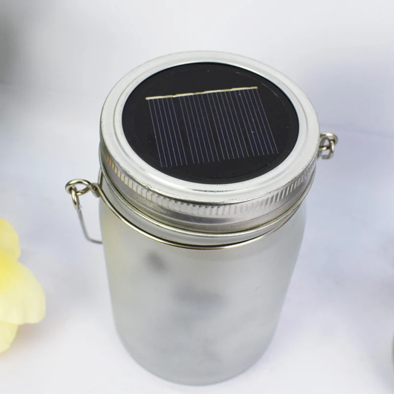 Solarbetriebene Milchglas-Feen-Silhouette-Mason-Jar-Laterne mit mehrfarbiger LED Skanto