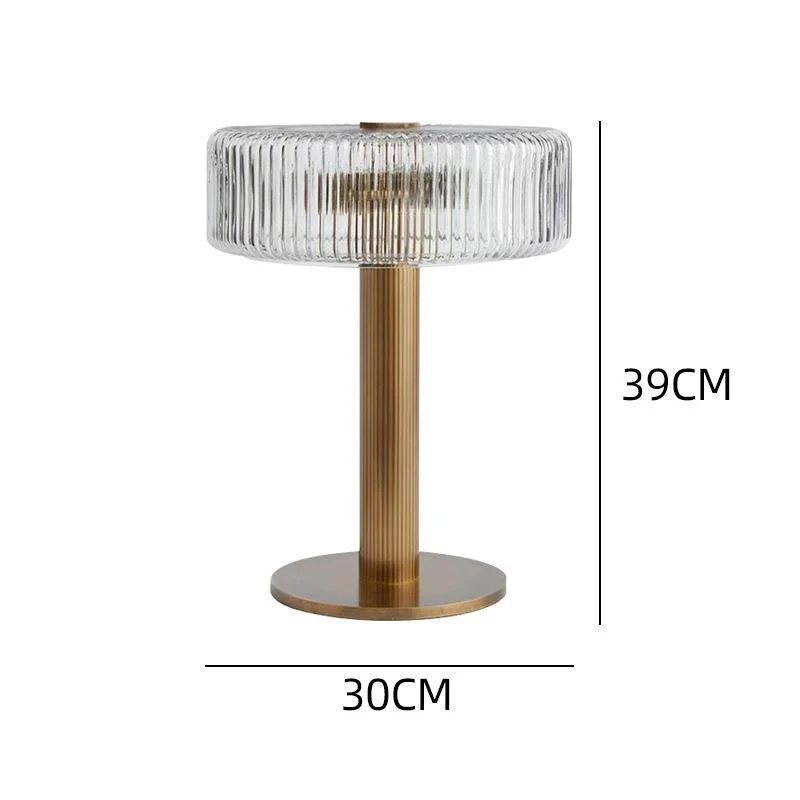 Elegante gerippte Glas- und Goldtischlampe