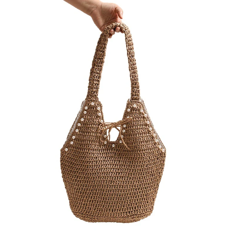 Handtasche mit Perlenverzierungen und innovativem Verschluss Skanto