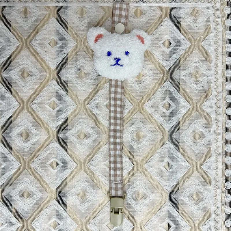 Blumenkleidungs-Schnullerclip mit Gingham-Baumwollgurt